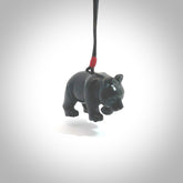 This picture shows a pendant that we designed in black jade. It is a little black bear that has a walking stance and is carved in detail. A really attractive and eye-catching piece of handmade jewellery. The cord is black and the length can be adjusted.